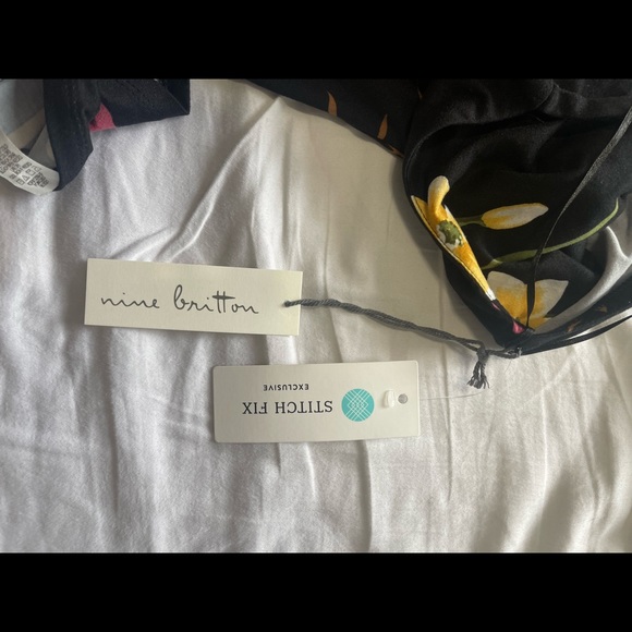 Never worn, floral, below the knee, asymmetrical faux wrap dress with tags. - Picture 2 of 4